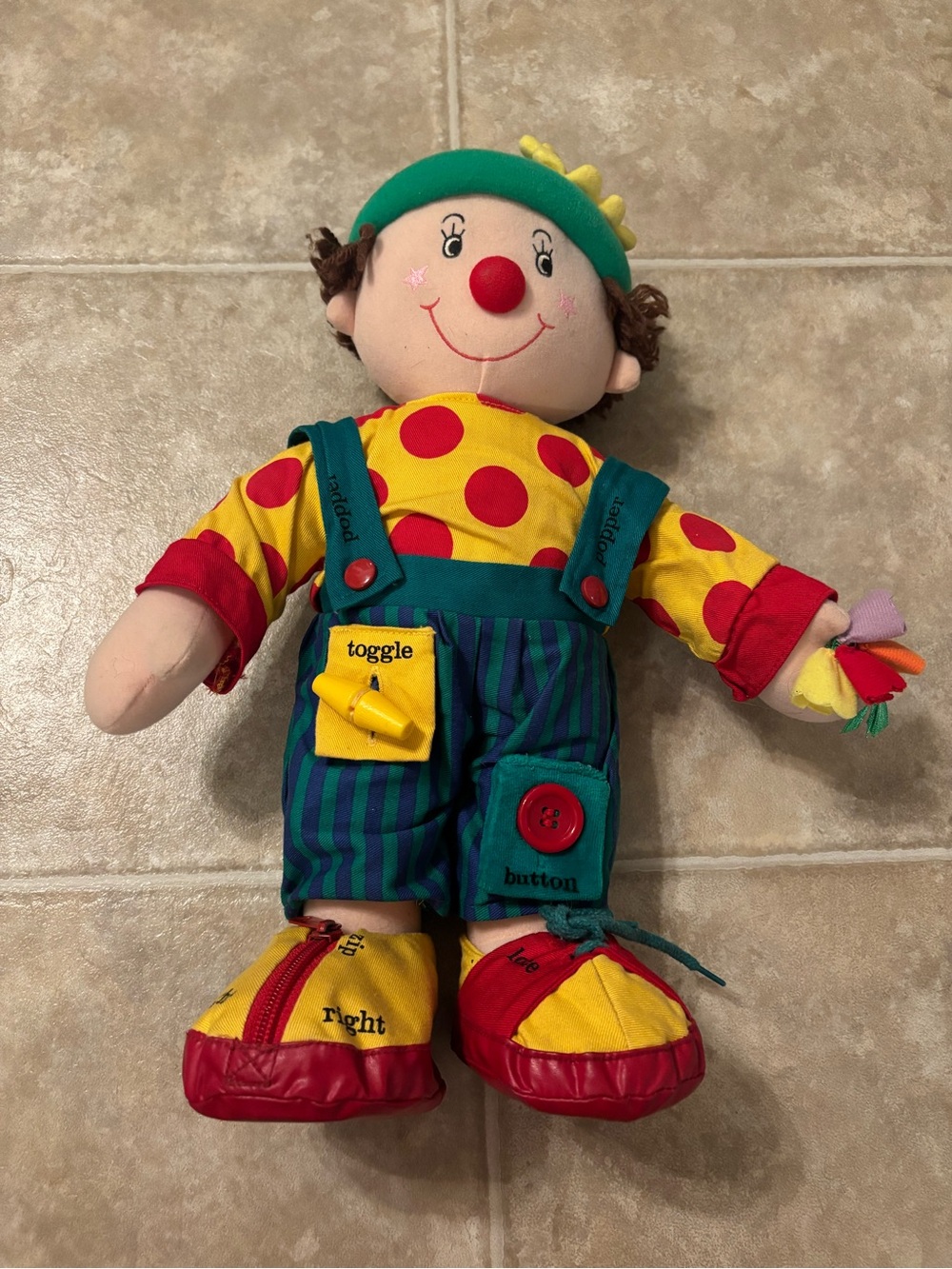 1990s vintage “chuckling Chester” learn to dress clown doll.